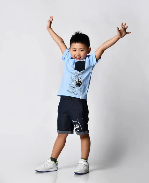 Asian boy in summer t-shirt and shorts posing for camera studio shot — Stock Photo, Image