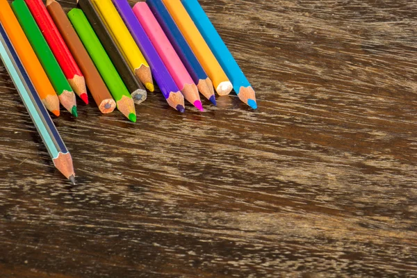 Sort crayons flooring surfaces, bright colors, red, yellow, blac — Stock Photo, Image