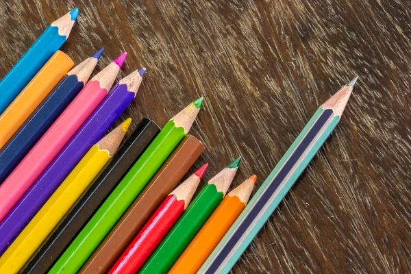 Sort crayons flooring surfaces, bright colors, red, yellow, blac — Stock Photo, Image