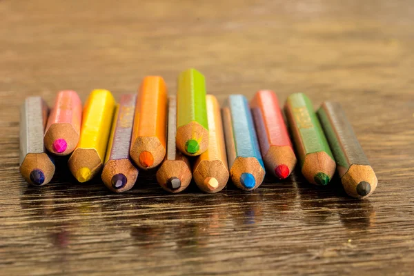 Sort crayons flooring surfaces, bright colors, red, yellow, blac — Stock Photo, Image