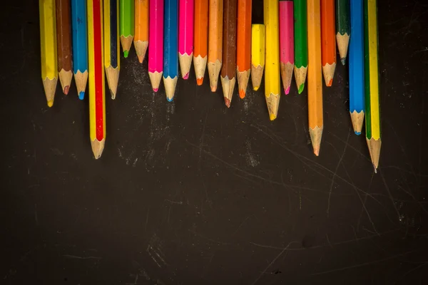 Dramatic group of pencils on black or dark background. — Stock Photo, Image