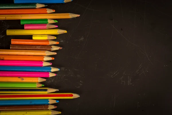Dramatic group of pencils on black or dark background. — Stock Photo, Image