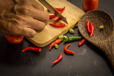 Young spring vegetables on black chalkboard from above. Backgrou