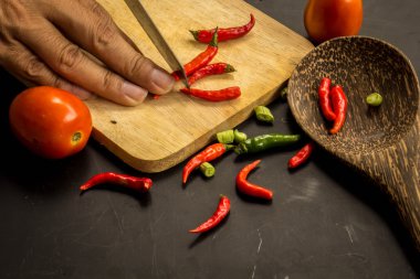 Young spring vegetables on black chalkboard from above. Backgrou