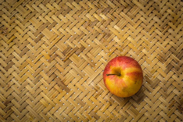 Low key image of red apples over wodden textured table — Stock Photo, Image