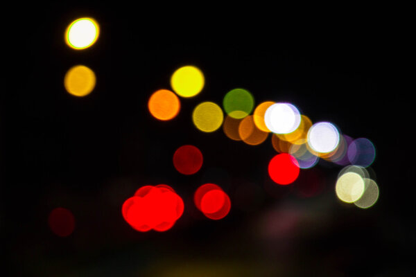 Artistic style - Defocused urban abstract texture bokeh city lights in the background with blurring lights for your design