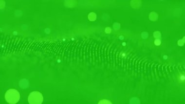 Parlayan ışık parçacıkları ile yeşil soyut teknoloji dalgası