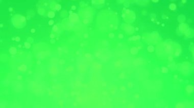 Soyut arkaplan taşıyan yeşil bokeh ışık parçacıkları