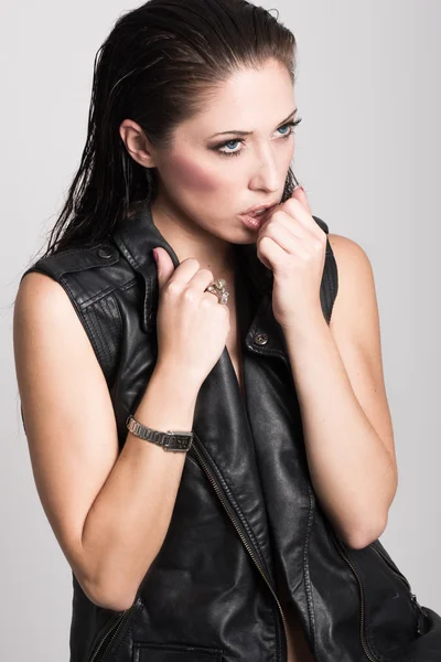 Brunette woman wearing black leather jacket and panties — Stock Photo, Image