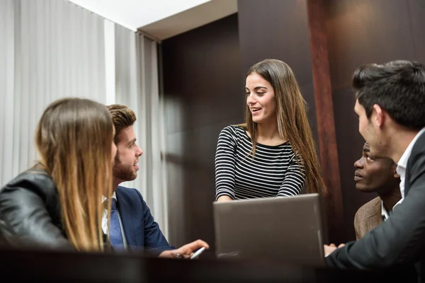 Group of multiethnic busy people working in an office — Stock Photo, Image