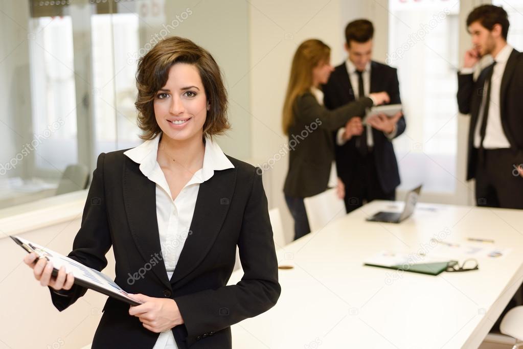 Business leader looking at camera in working environment 