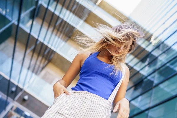 View from above of young girl moving her hair wild — Stock Photo, Image