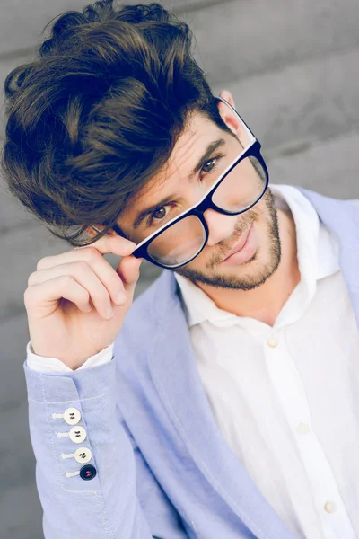 Cheerful trendy guy with black eyeglasses on — Stock Photo, Image
