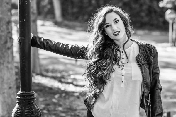 Girl with long hair wearing leather jacket — Stock Photo, Image