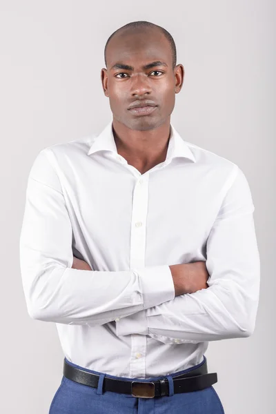 Black man wearing casual clothes in black background — Stock Photo, Image