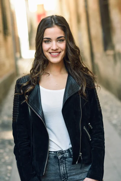 Woman in urban background wearing casual clothes