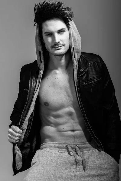 Athletic man wearing hoodie jacket. Studio shot — Stock Photo, Image