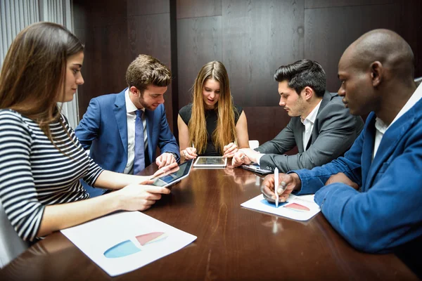 Group of multiethnic busy people working in an office — Stock Photo, Image