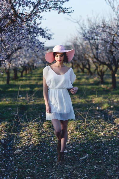 Portrait of young woman in the flowered garden in the spring tim — Stock Photo, Image