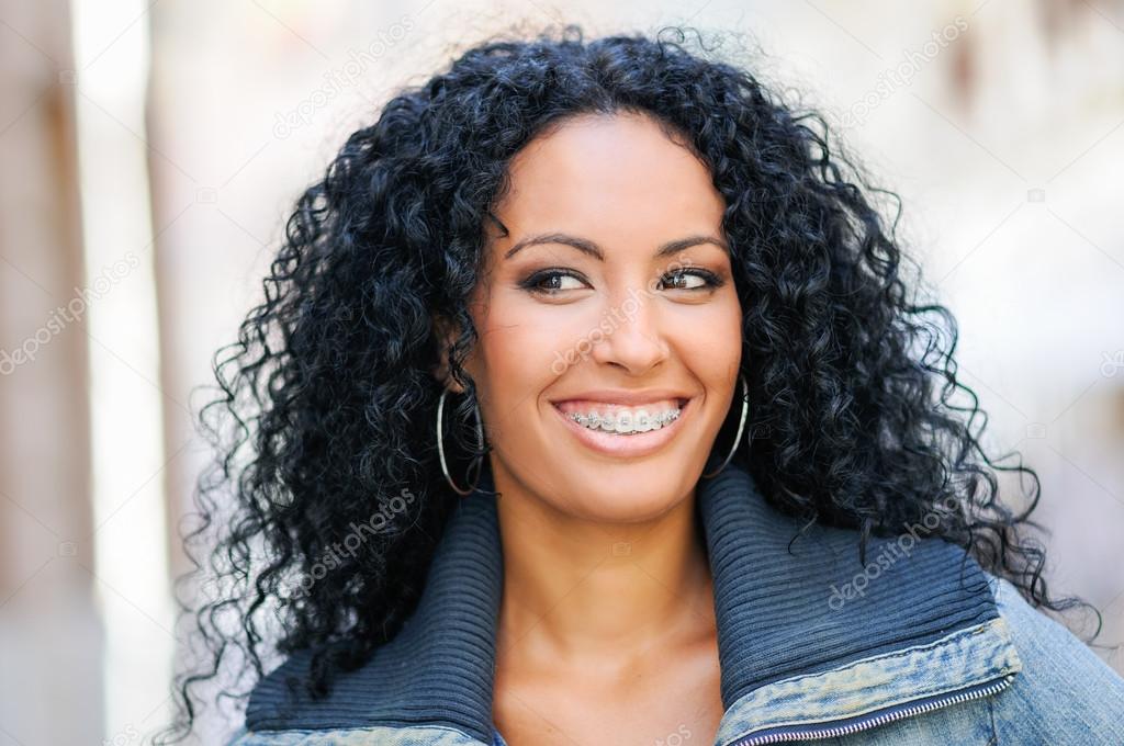 Young black woman smiling with braces