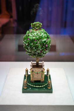Saint Petersburg, Russia - ca. December 2017: Green Bay Tree Faberge Easter Egg  at the Faberge Museum in the Shuvalov Palace. clipart
