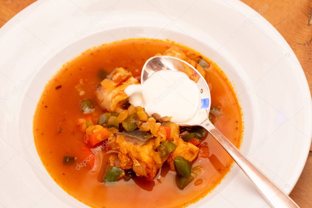 Halaszle, Hungarian Fishermans Soup or Fish Stew with Carp, Bell Peppers, Paprika and Sour Cream