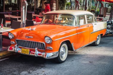 Miami, United States - July 7 2012: 1955 Chevrolet Chevy Bel Air 4 Door Sedan in Orange,  2400 C Series, Second Generation. clipart