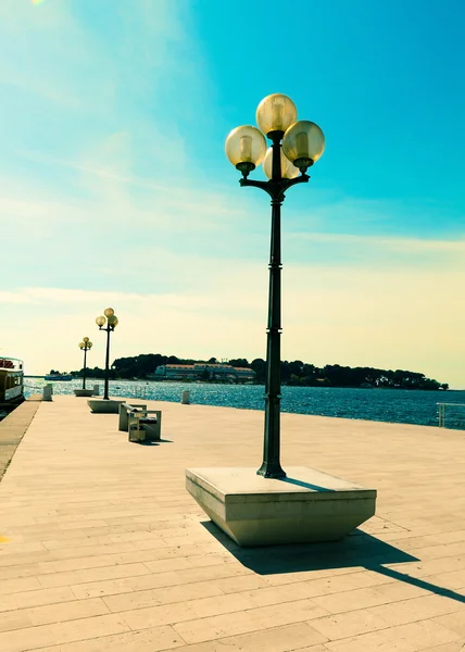 Berth with street-lamp on sea background. Pula Croatia — Stock Photo, Image