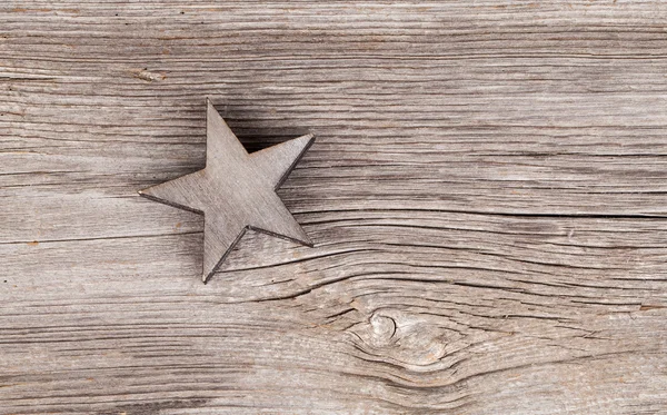 Velha estrela xmas no fundo do vintage de madeira — Fotografia de Stock