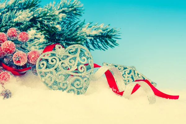 Christmas decoration over snow, blue background — Stock Photo, Image