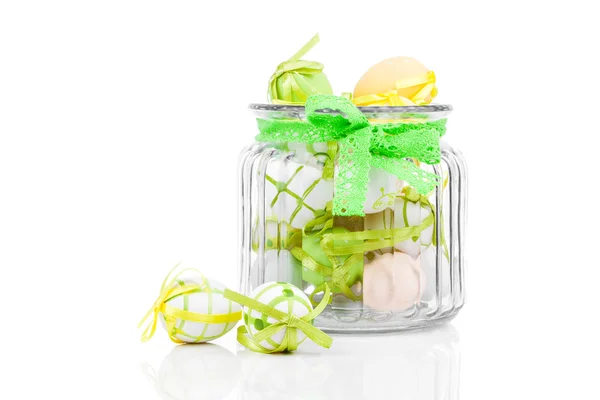 Glass jar full with Easter eggs, on white background — Stock Photo, Image