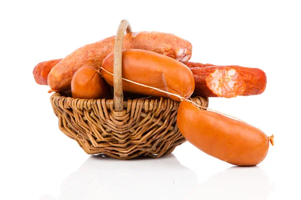 Smoked sausage on a string in basket. Isolated on white backgrou — Stock Photo, Image