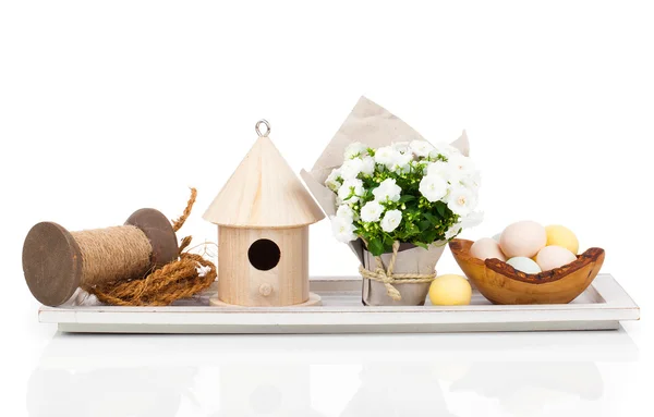 Easter eggs with birdhouse and white Campanula flowers , isolate — Stock Photo, Image