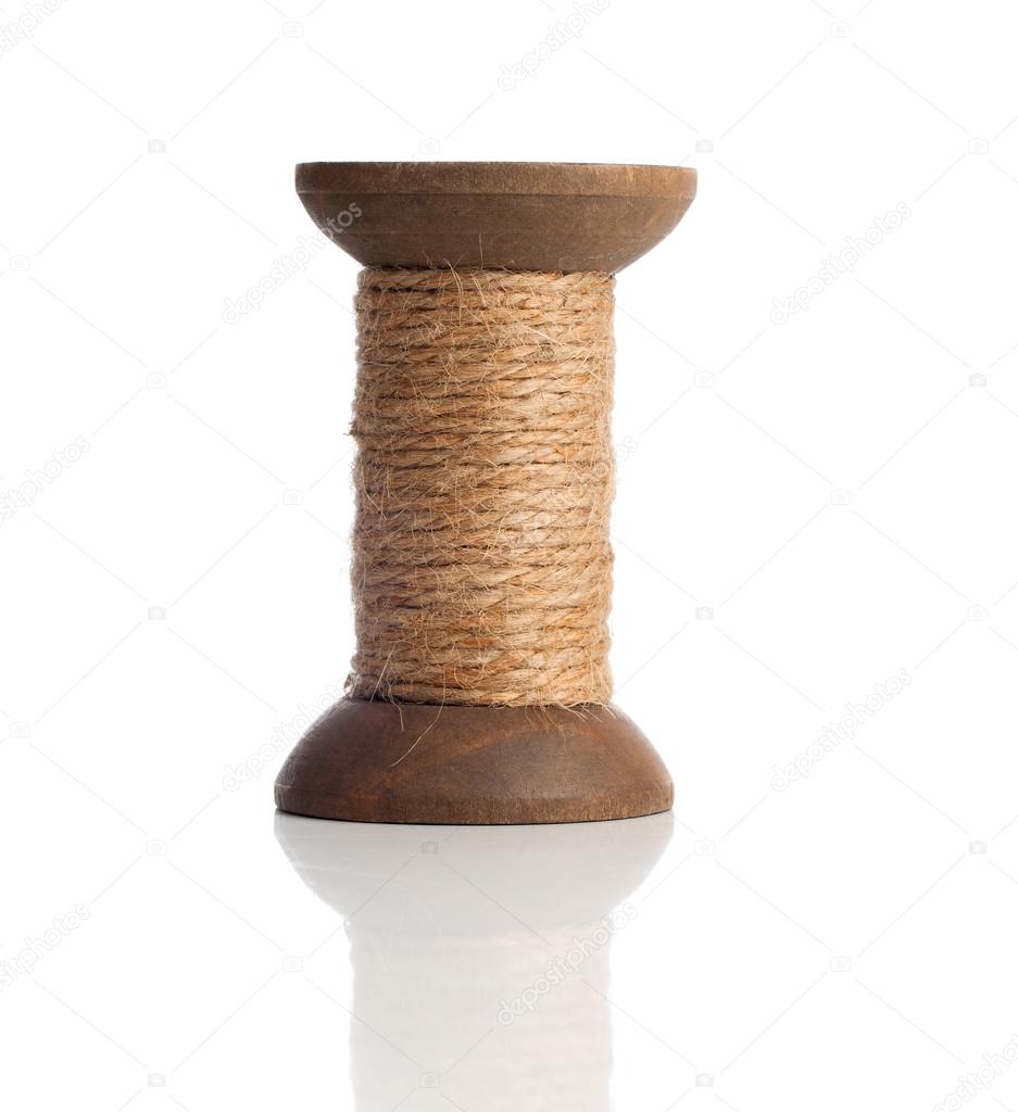Old wooden bobbins of thread, vintage, isolated on white 