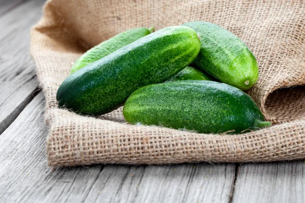 Cucumbers on the wooden background — Stock Photo, Image