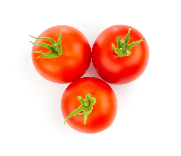 Tomates rojos aislados sobre un fondo blanco. — Foto de Stock