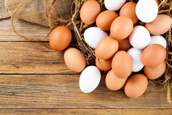 Eggs on wooden background — Stock Photo, Image