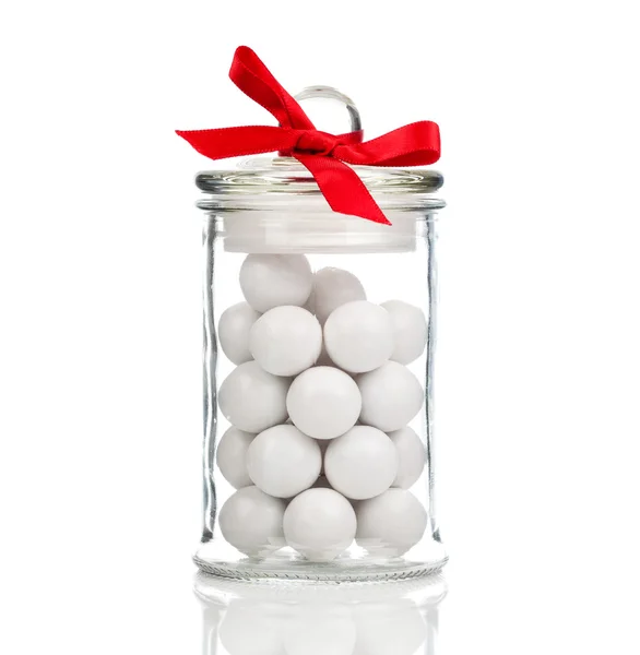 White candies, Gumballs in glass jar, over white background — Stock Photo, Image