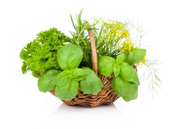 Basil, parsley and dill in wicker basket, on a white background — Stock Photo, Image
