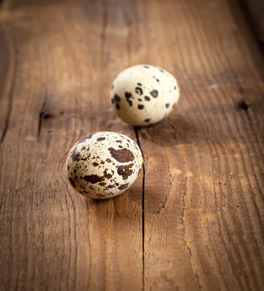 Quail eggs on wooden background — Stock Photo, Image