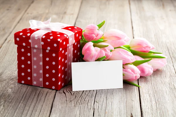 Beautiful tulips with red polka-dot gift box. happy mothers day, — Stock Photo, Image