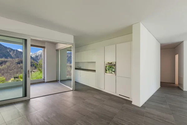 Interior, wide room with domestic kitchen — Stock Photo, Image