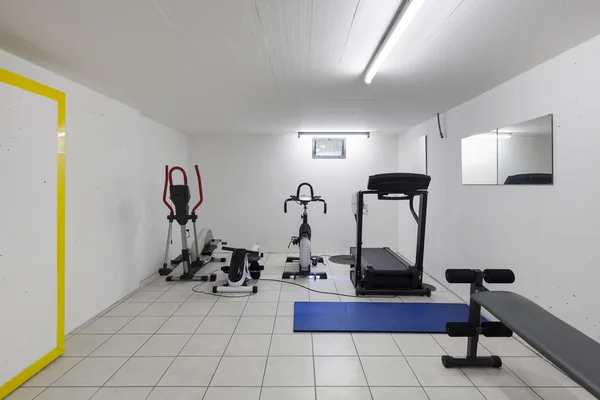 Interior, garage with fitness equipment — Stock Photo, Image