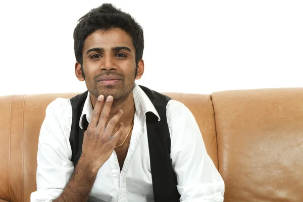 Man sitting on the couch — Stock Photo, Image