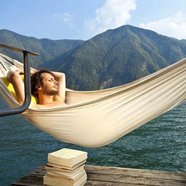 Young man on the dock of Lake — Stock Photo, Image