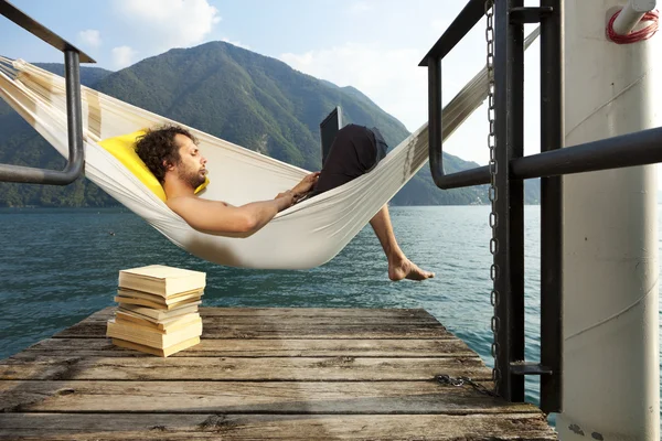 Young man on the dock of Lake — Stock Photo, Image