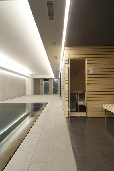 Indoor swimming pool with sauna — Stock Photo, Image