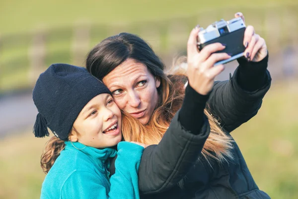 Woman and child shooting selfie — Stock Photo, Image