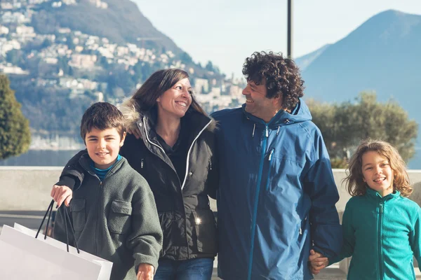 Happy family walking outdoors in city — Stock Photo, Image