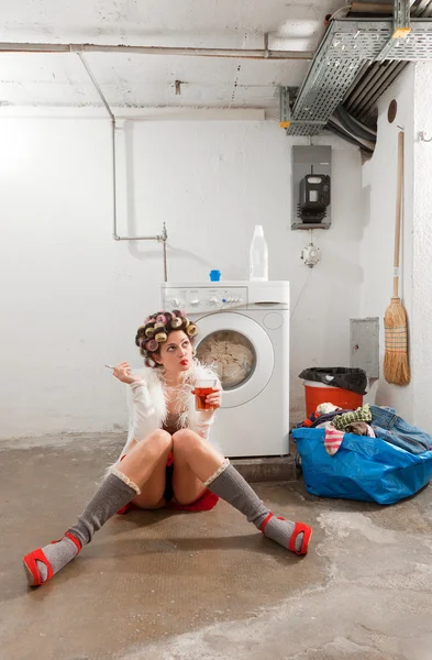 Housewife bored in the laundry — Stock Photo, Image